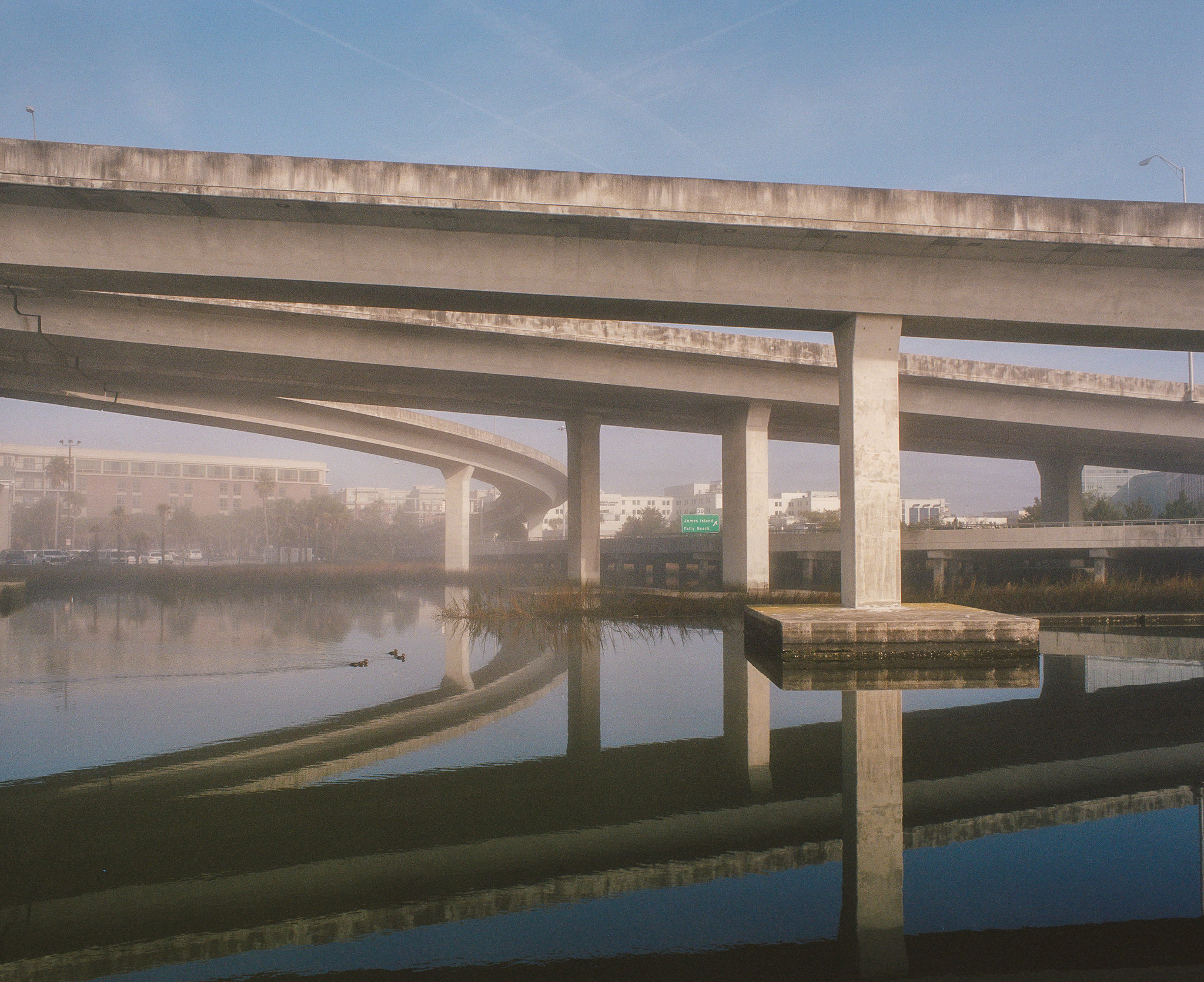 Charleston overpass reflected in Lowcountry waterway at dawn — 105mm f/2.4, Portra 400