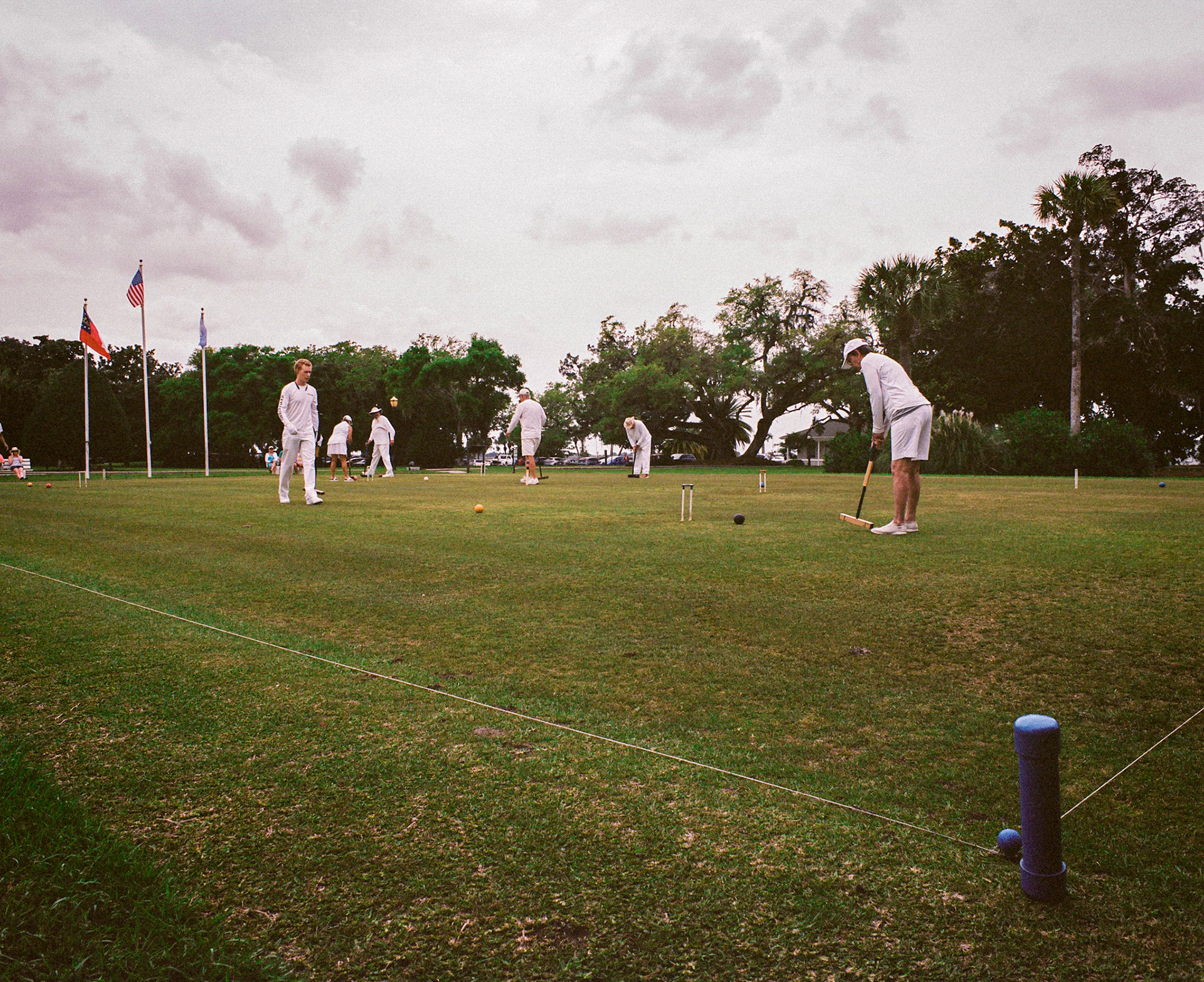 Croquet match on a Charleston green under live oaks — 105mm f/2.4, Portra 400